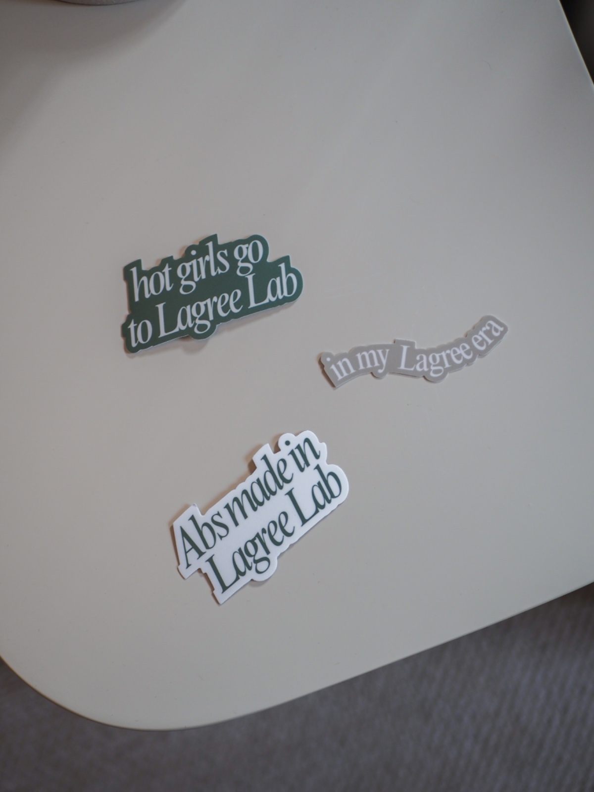 Lagree Lab sticker set laid out on a table